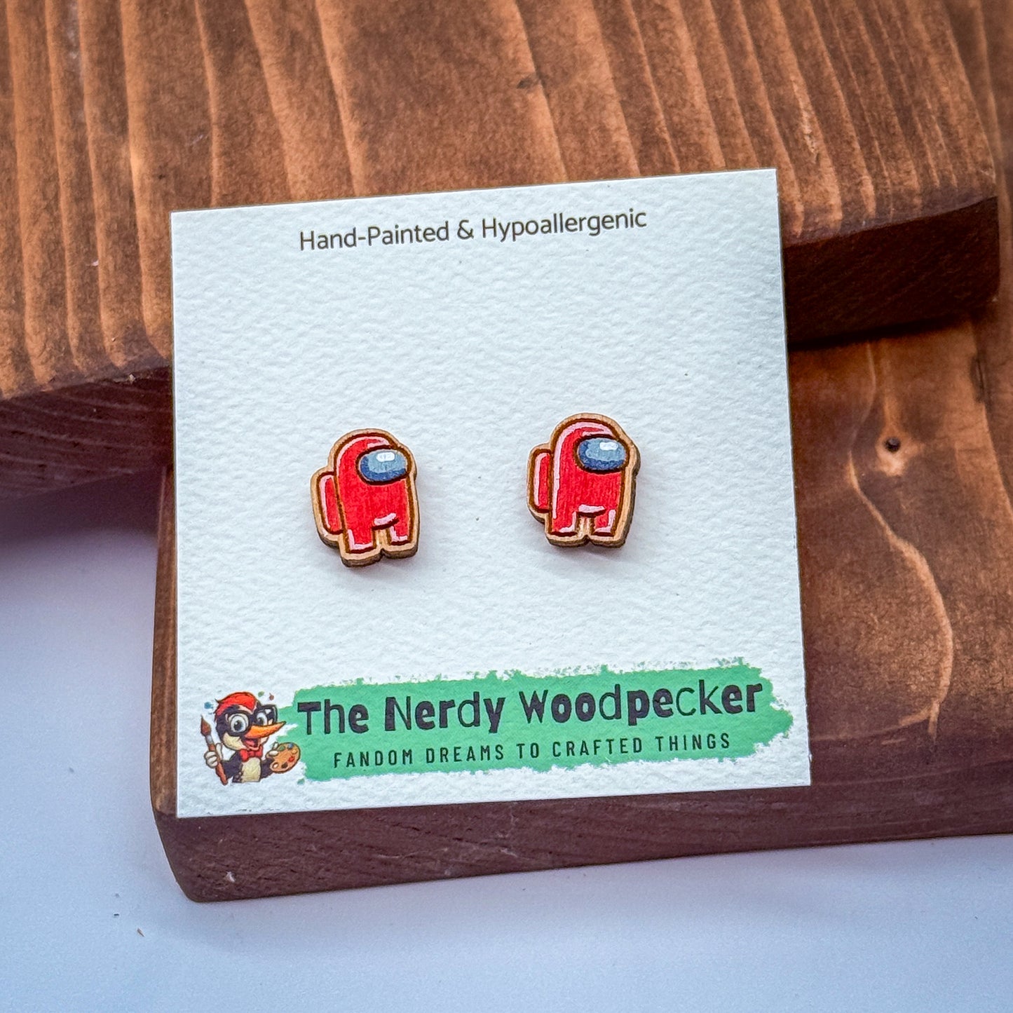 a pair of earrings shaped like the character from the video game "Super Mario Bros."