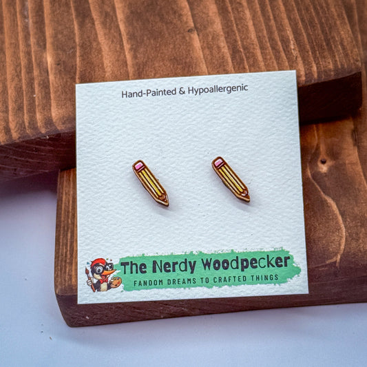 a pair of hand-painted and hypoallergenic earrings with a wooden background.