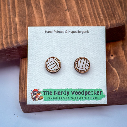 a pair of wooden earrings on a white card, with a cartoon character and text related to the earrings.