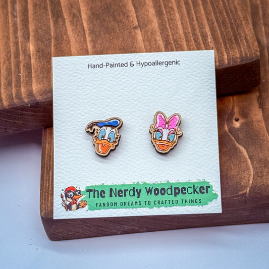 A pair of hand-painted and hypoallergenic earrings featuring cartoon-style characters, likely from the Disney movie "The Nerdly Woodpecker".