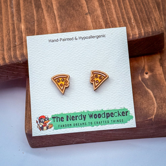 a pair of earrings made of wood, with a white card displaying the earrings and the name of the seller.