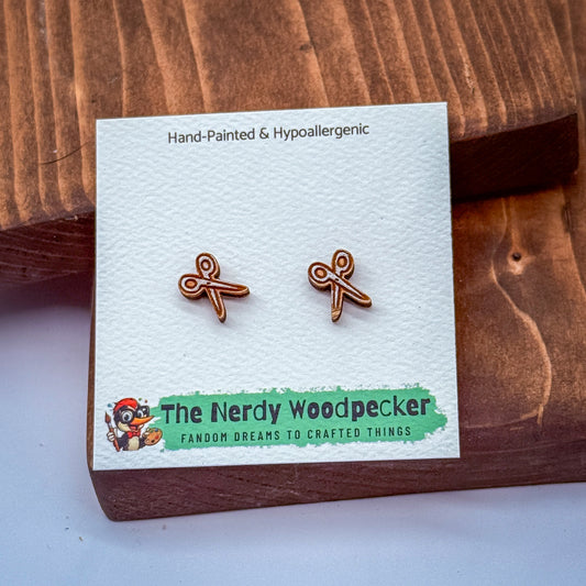a pair of hand-painted and hypoallergenic earrings with a wooden packaging.